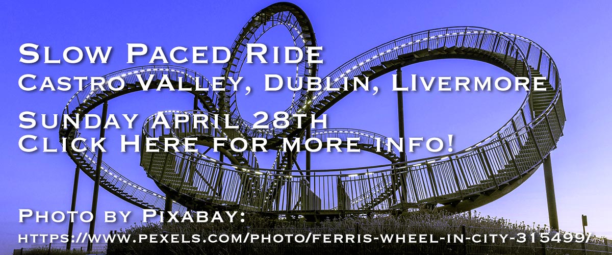 A background image of a silhouette of roller coaster with purple sky with White type on it saying Slow Paced Ride on the first line near the top and Castro Valley, Dublin, Livermore on the second line and Sunday April 28th on the third line and Click Here for more info! on the fourth line and Photo by Pixby: on the fifth line and Photo by Pixabay: https://www.pexels.com/photo/ferris-wheel-in-city-315499/ on the sixth line.