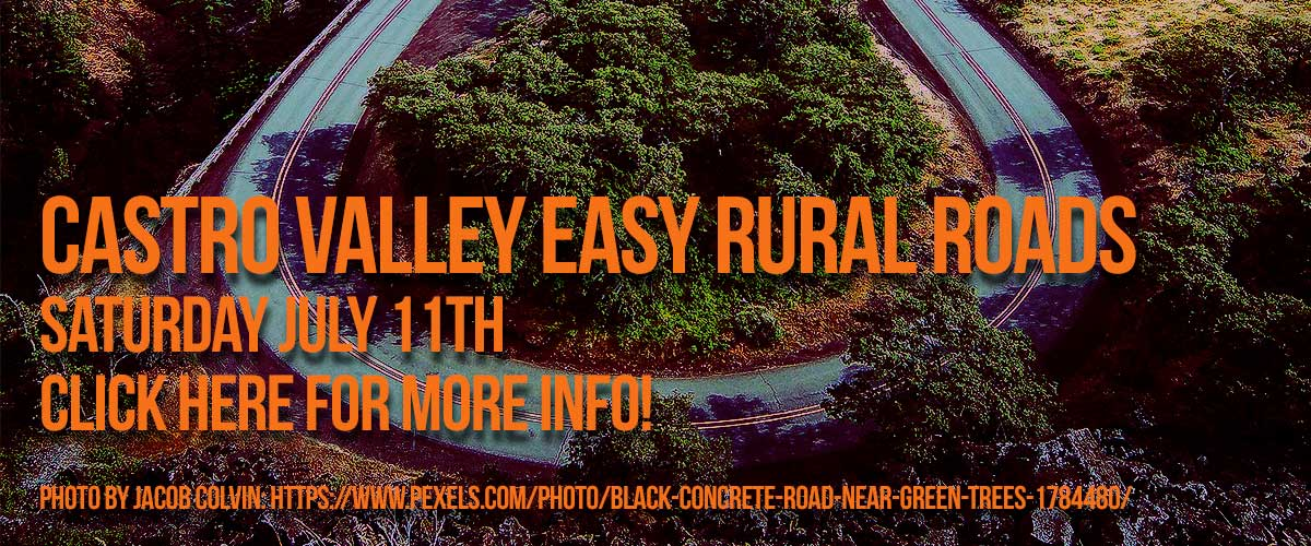 Orange type saying on the first line, Castro Valley Easy Rural Roads and on the second line, Saturday July 11th and Click Here for more Info! on the third line and Photo by Life of Pix: and Photo by Jacob Colvin: https://www.pexels.com/photo/black-concrete-road-near-green-trees-1784480/ on the fourth line and on the fifth line with a background of road loop with trees in the center of the loop and outside of the loop.