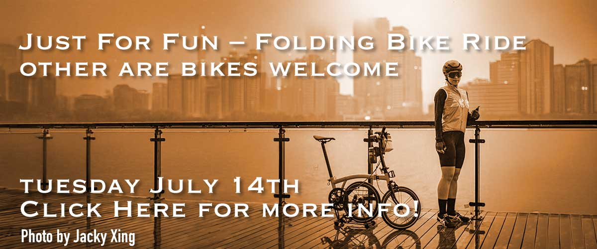 Orange casted background image of a cyclist with a folding bike standing standing on a boardwalk with with a bay and cityscape behind her with white type overlaying it saying Just For Fun – Folding Bike Ride on the first line with other are bikes welcome on the second line and Tuesday July 14th on the third line and Click here for more info! on the fourth line and Photo by Jacky Xing on the fifth line.