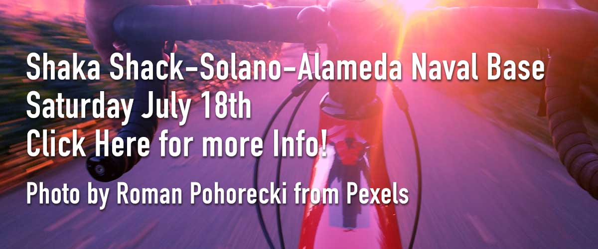 Background image of the road bike handlebars riding on a road with the sun flaring onto the handlebars overlaying white type saying Shaka Shack-Solano-Alameda Naval Base on the first line and Saturday July 18th on the second line and Click Here for more Info on the third line and Photo by Roman Pohorecki from Pixels on the fourth line.